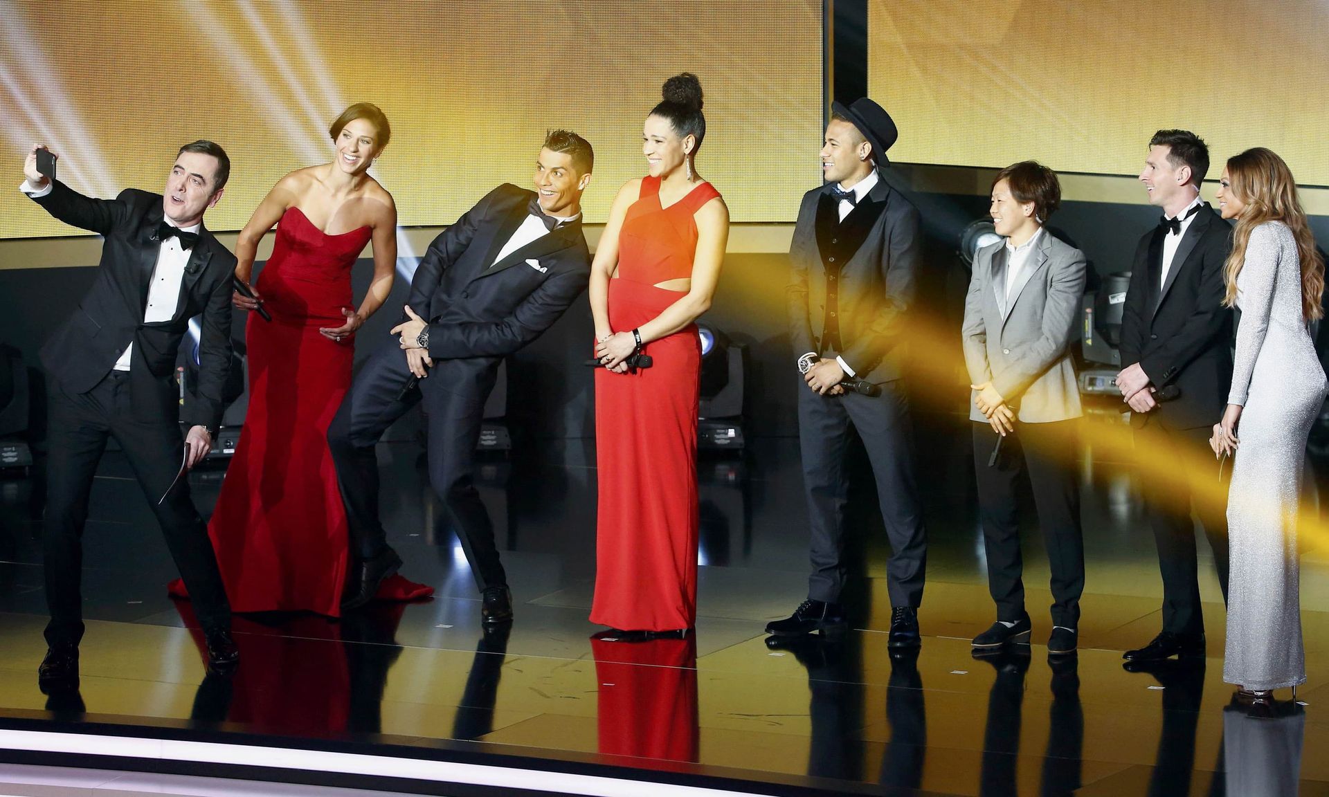Ceremony's host British actor Nesbitt takes a selfie with Lloyd, Ronaldo, Sasic, Neymar, Miyama, Messi and Abdo during the FIFA Ballon d'Or 2015 awards ceremony in Zurich