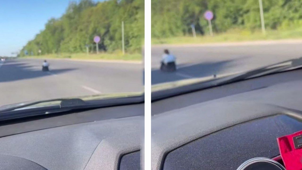 Женщина, сидящая посреди дороги в Днепре.